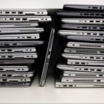 rack with a stack of laptops in the storage room of a company